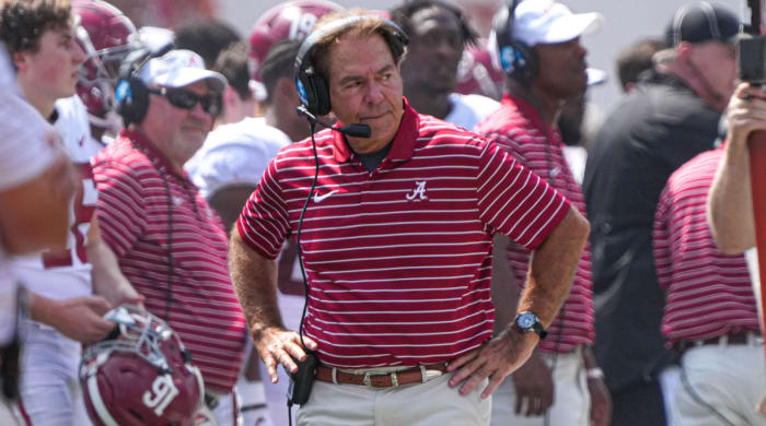Alabama coach Nick Saban stands with his hands on his hips during a game against Texas.